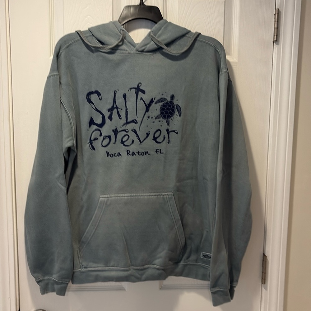 Woman’s green hoodie … small stain on hood